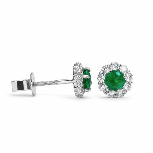 Colombian emerald and diamond studs in platinum 950 shown at an angle