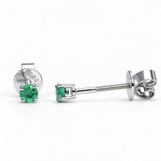 Colombian emerald studs in platinum 950 shown at an angle