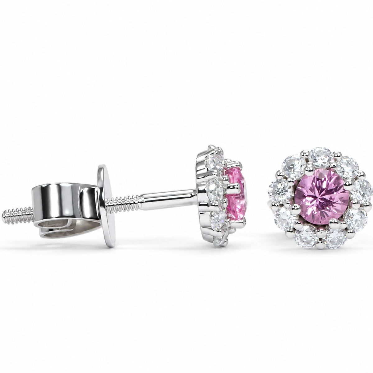 Pink sapphire halo studs in platinum 950 shown at an angle