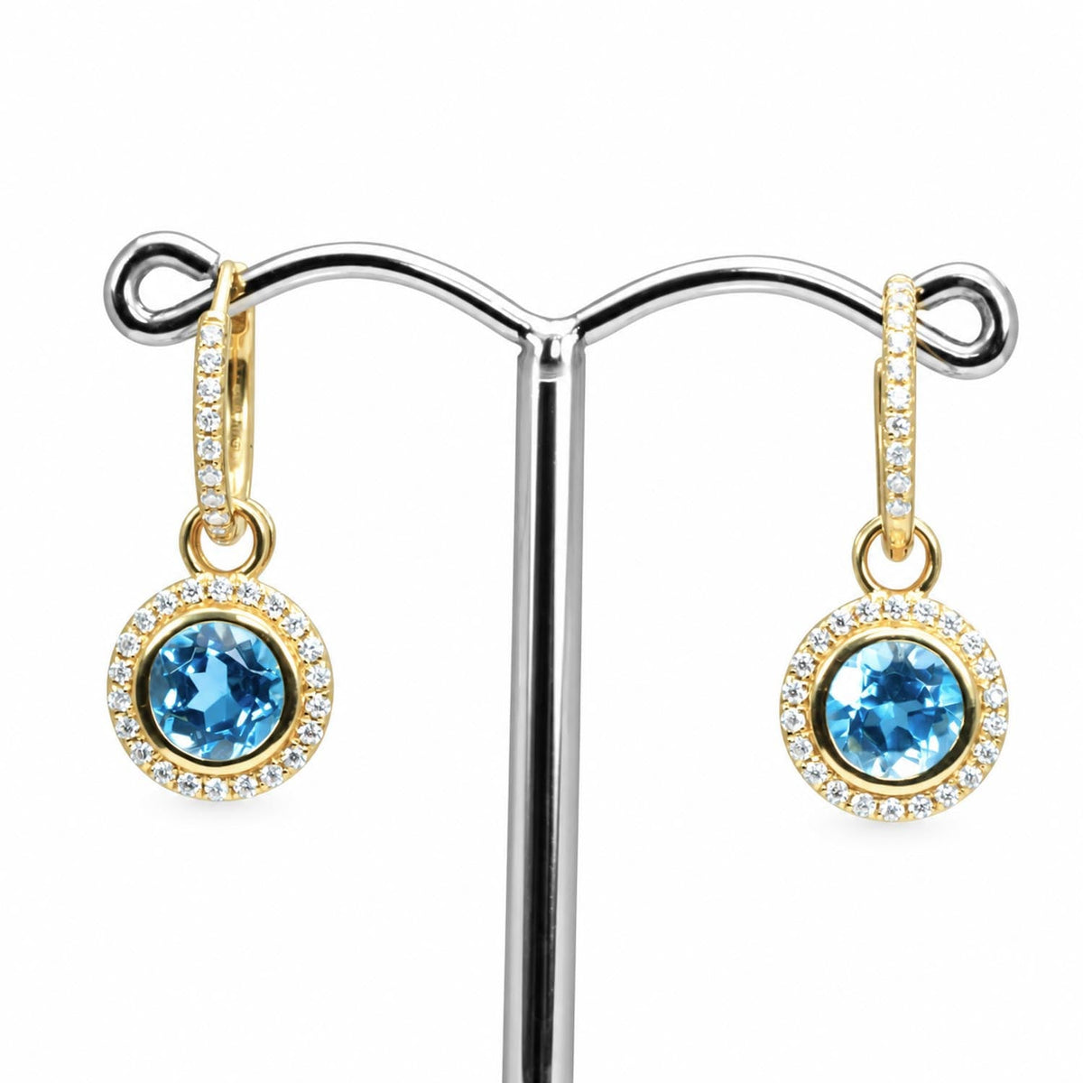 Swiss blue topaz dangle earrings with a moissanite halo in yellow gold