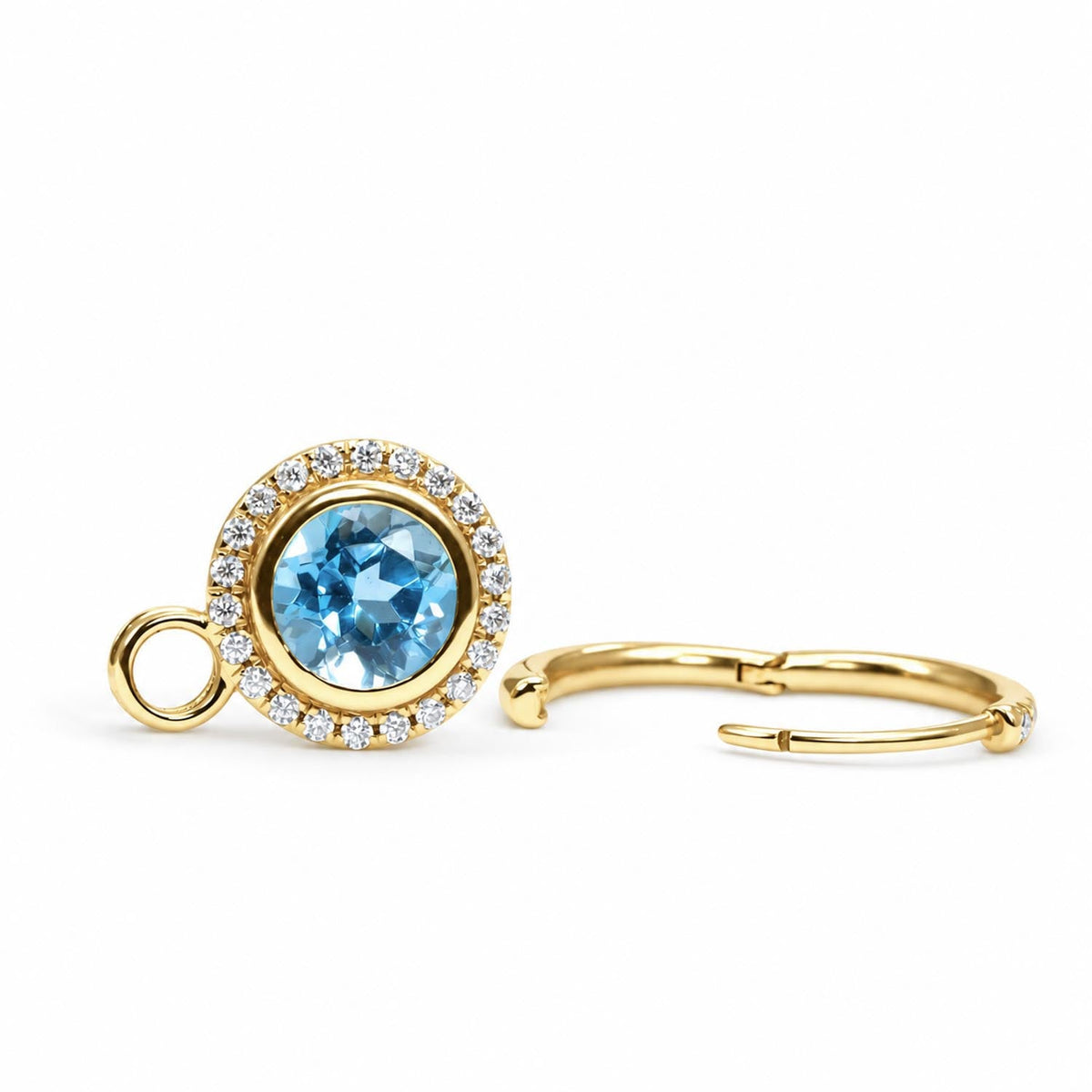 Close detail of the Swiss blue topaz and moissanite halo drops