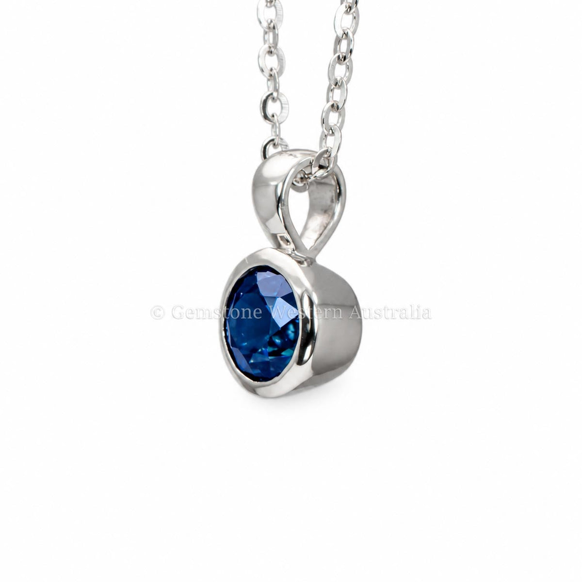 Blue sapphire platinum pendant shown at an angle