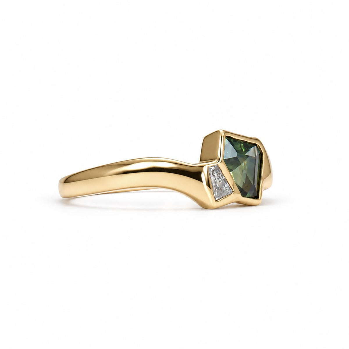 Teal sapphire and diamond gold ring shown at an angle