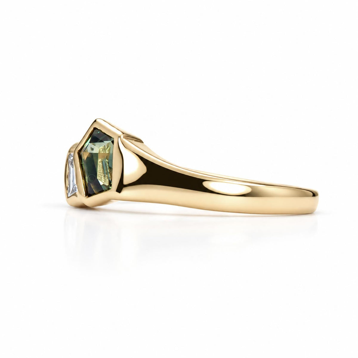 Pentagonal cut teal sapphire ring with diamonds shown at an angle