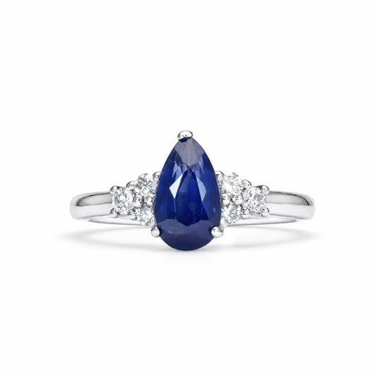 Pear shaped royal blue sapphire and diamond ring in platinum