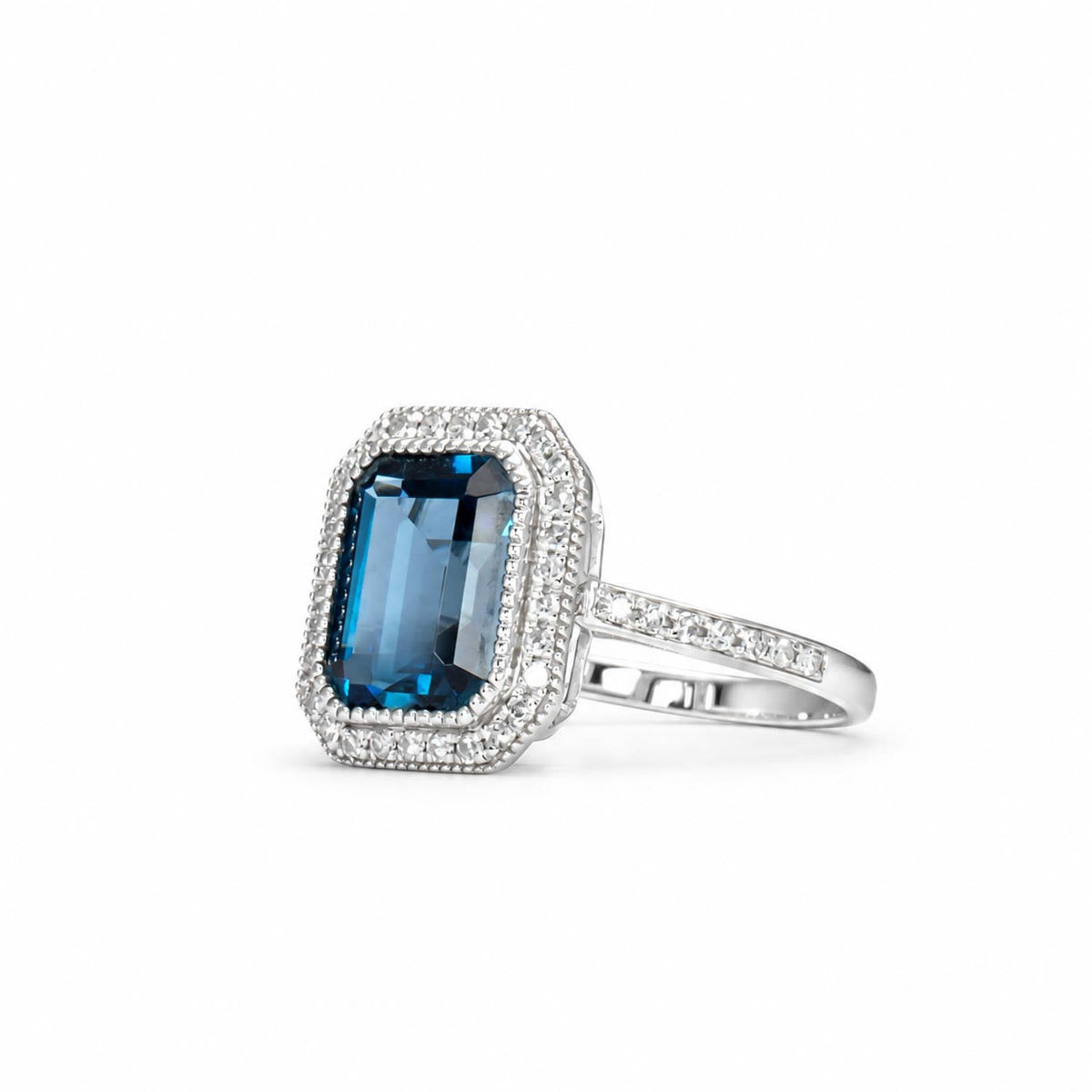 London blue topaz and diamond ring in 18K white gold shown at an angle