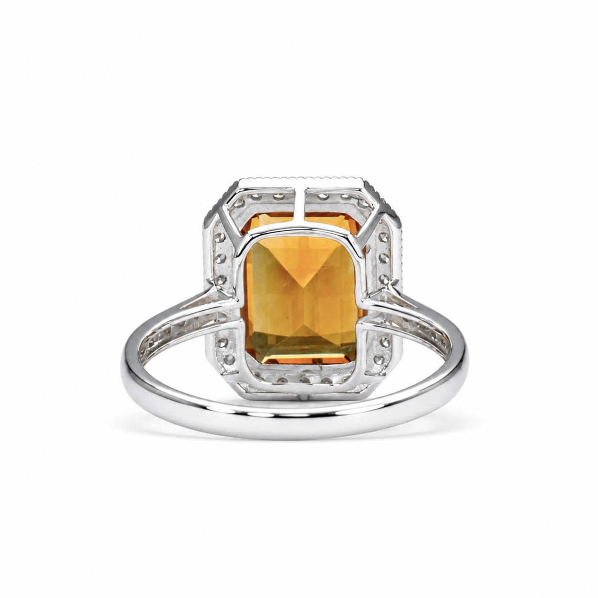 Side profile of the emerald cut citrine halo ring in 18K white gold