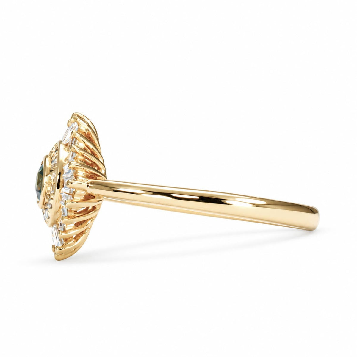 Bezel set round teal sapphire ring in 18K yellow gold shown at an angle