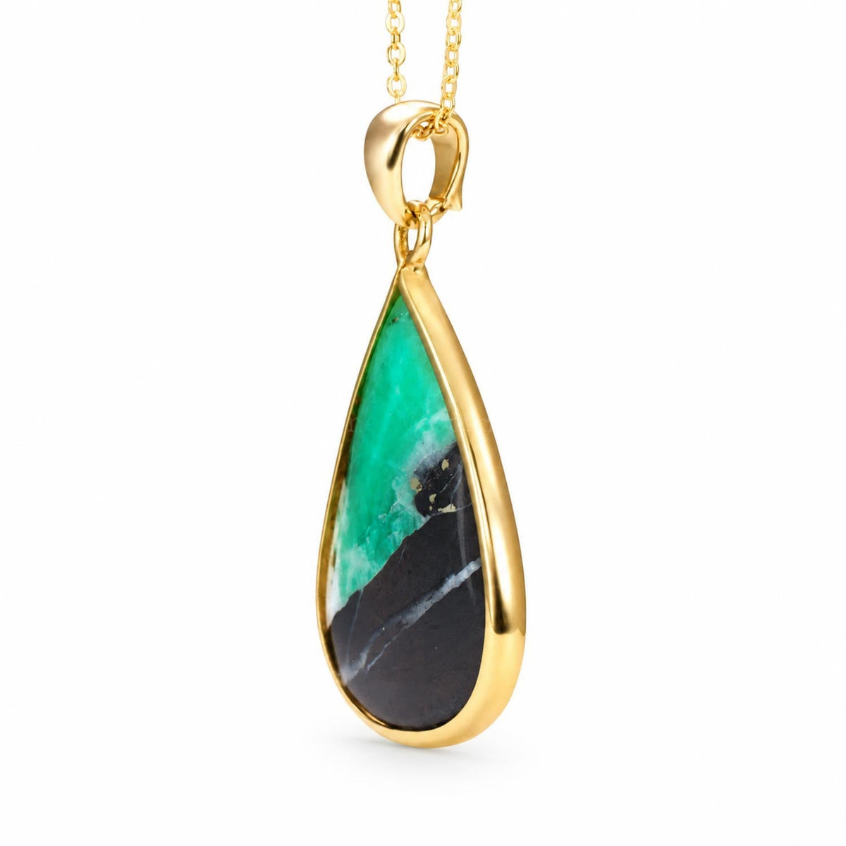 Colombian emerald in matrix pendant in 18K yellow gold shown at an angle