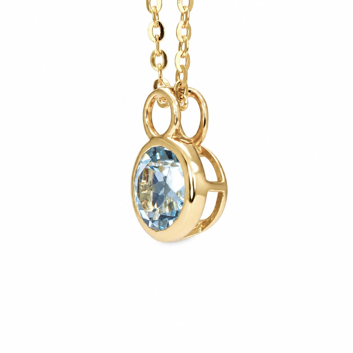 Round aquamarine pendant in 14K yellow gold shown at an angle