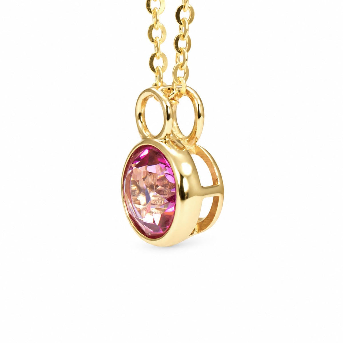 Round pink topaz pendant in 14K yellow gold shown at an angle