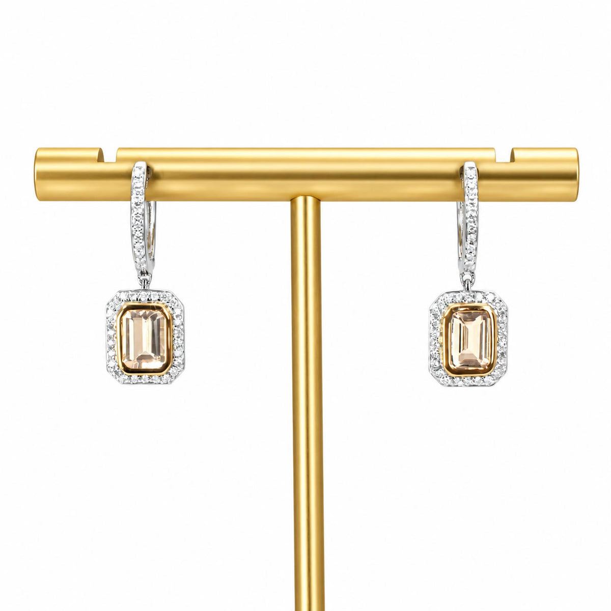 A pair of rectangular drop earrings displayed on a gold T-bar stand against a white background. Each earring features a central morganite rectangular gemstone surrounded by a halo of diamonds, with a white gold hoop above.