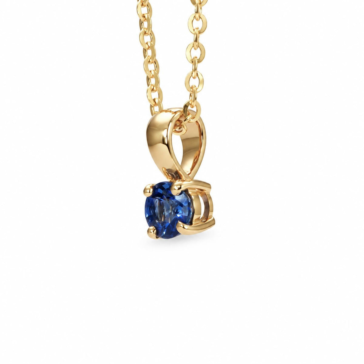 Blue sapphire pendant in 18K yellow gold shown at an angle