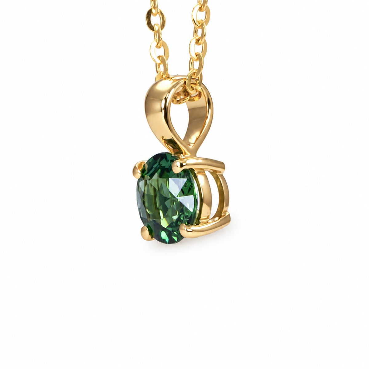 Australian teal sapphire pendant in 18K yellow gold shown at an angle