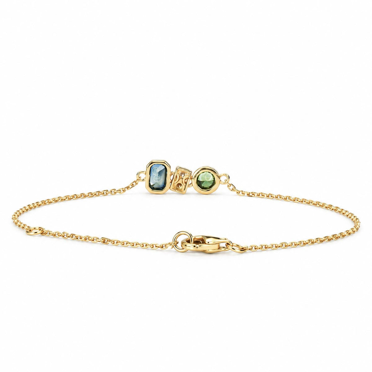 Clasp detail of the dainty teal sapphire and diamond gold bracelet