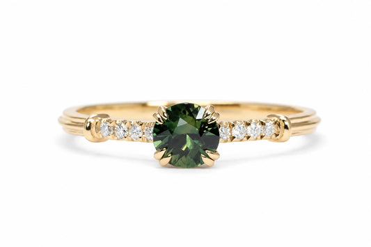 Round Australian teal sapphire ring with a diamond band in 18K yellow gold