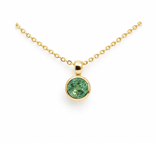 Colombian emerald bezel set pendant in 18K yellow gold