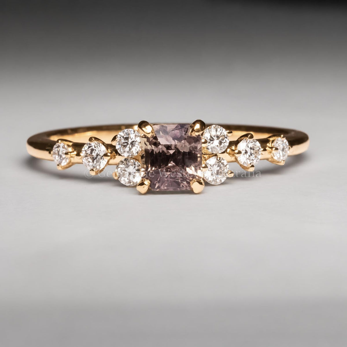 Octagon cut alexandrite and diamond ring in 18K yellow gold, angled view