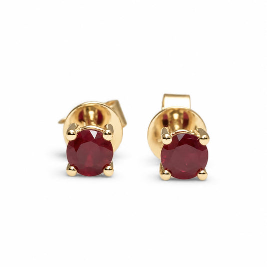 Natural ruby stud earrings in 18K yellow gold with a classic four claw design