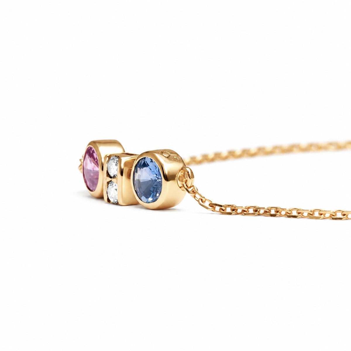 Unheated pink and blue sapphire diamond bracelet in 18K yellow gold, angled view