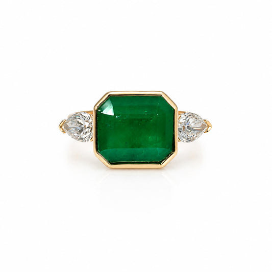 front view of Colombian Emerald and Diamond Ring in 18K Yellow Gold – East West Emerald Cut in white background