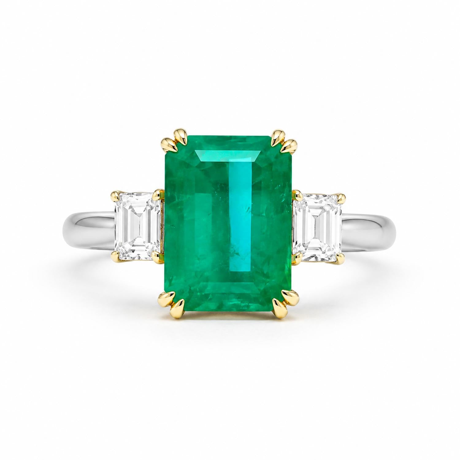 An emerald-cut emerald Colombian emerald ring with yellow gold prongs and side square cut diamonds on a polished platinum band, set against a plain white background.