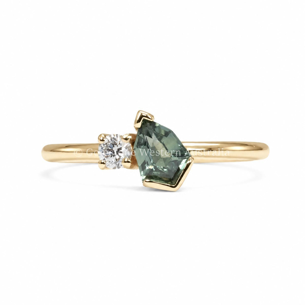 Teal sapphire and diamond toi et moi ring in 18K yellow gold with a shield cut design