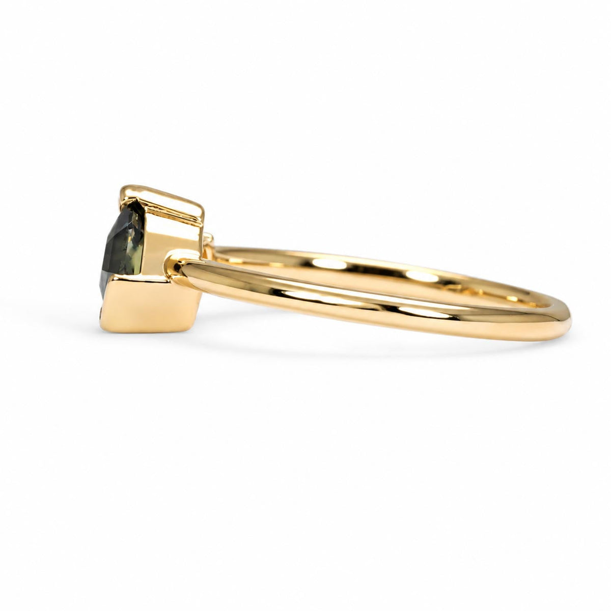 Shield cut teal sapphire toi et moi ring in 18K yellow gold, angled view