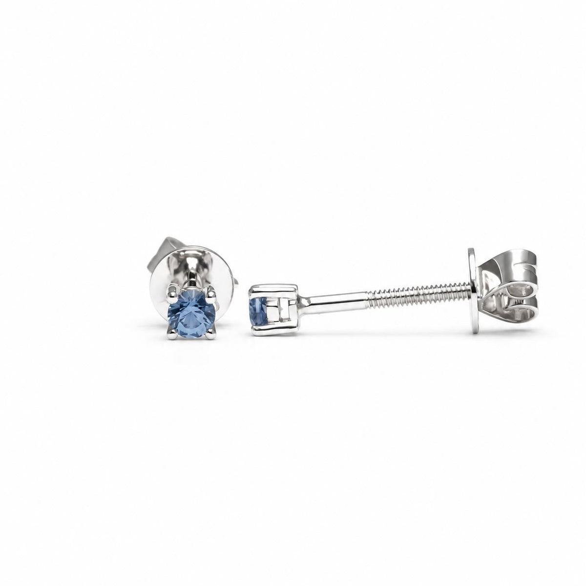 2.5mm round blue sapphire studs in platinum shown at an angle