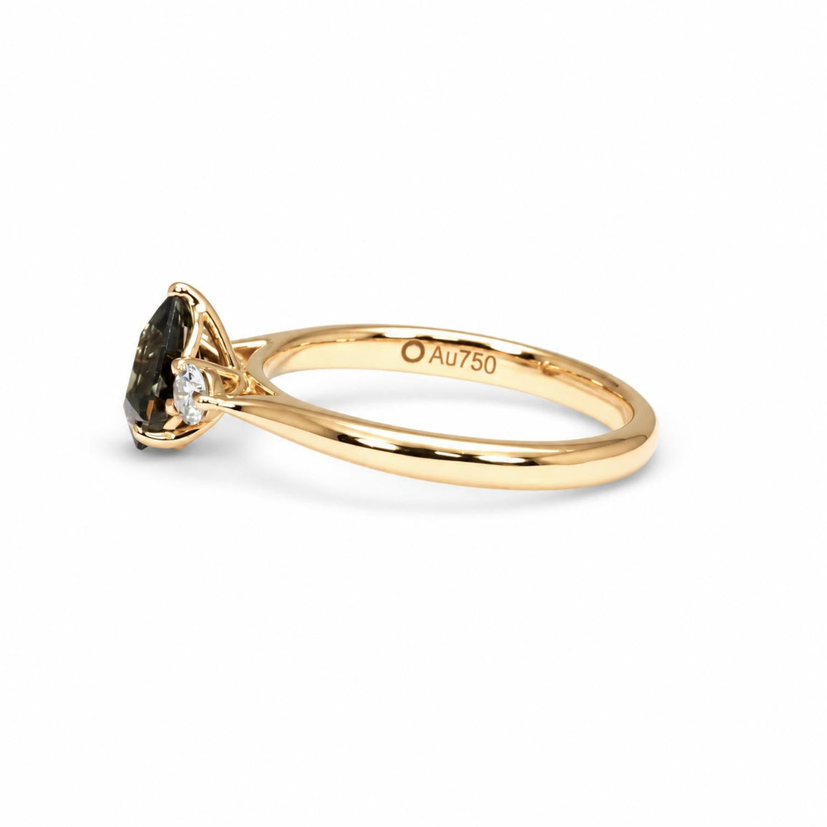 0.80ct shield cut teal sapphire ring in 18K rose gold shown at an angle