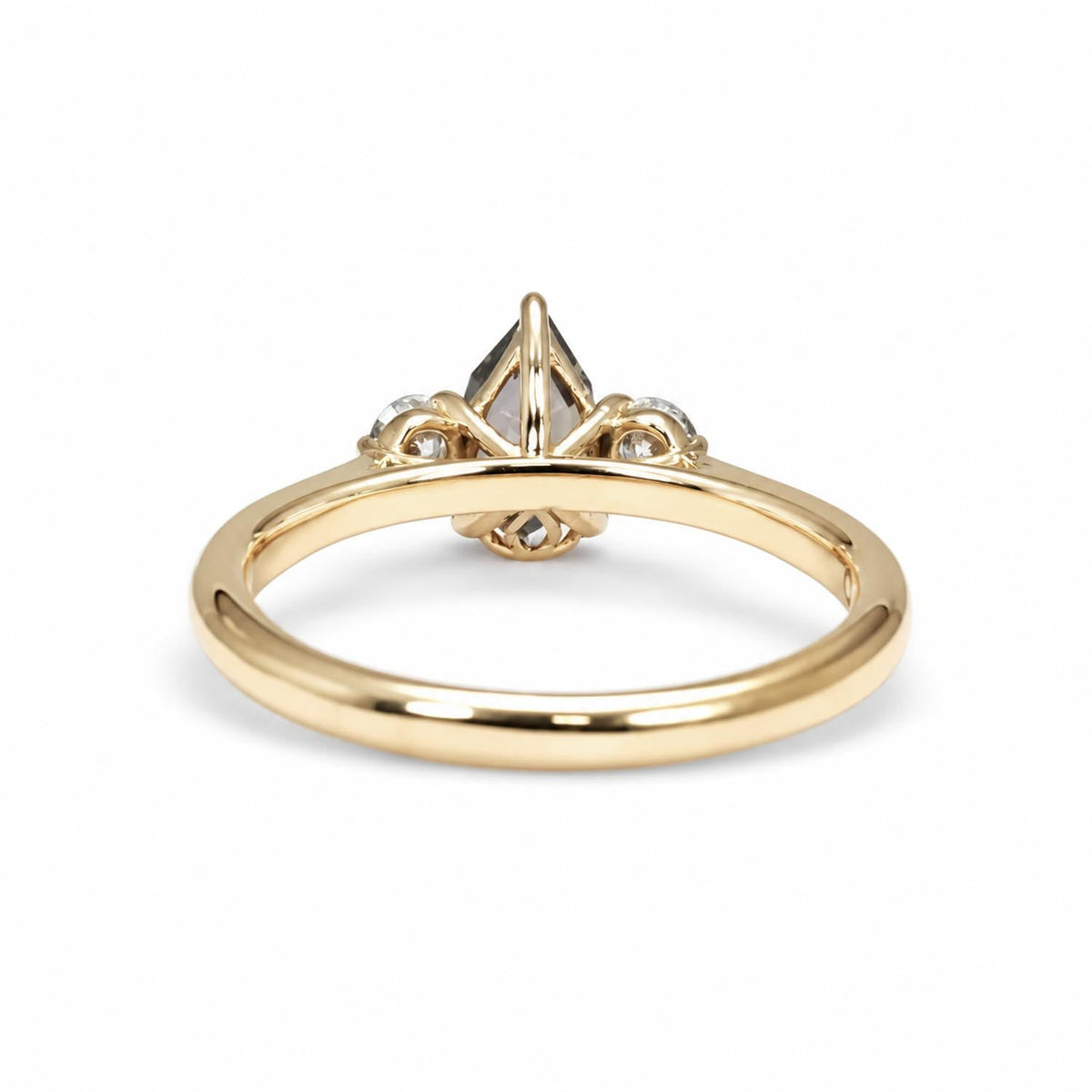 Top view of the teal sapphire and diamond ring in 18K rose gold