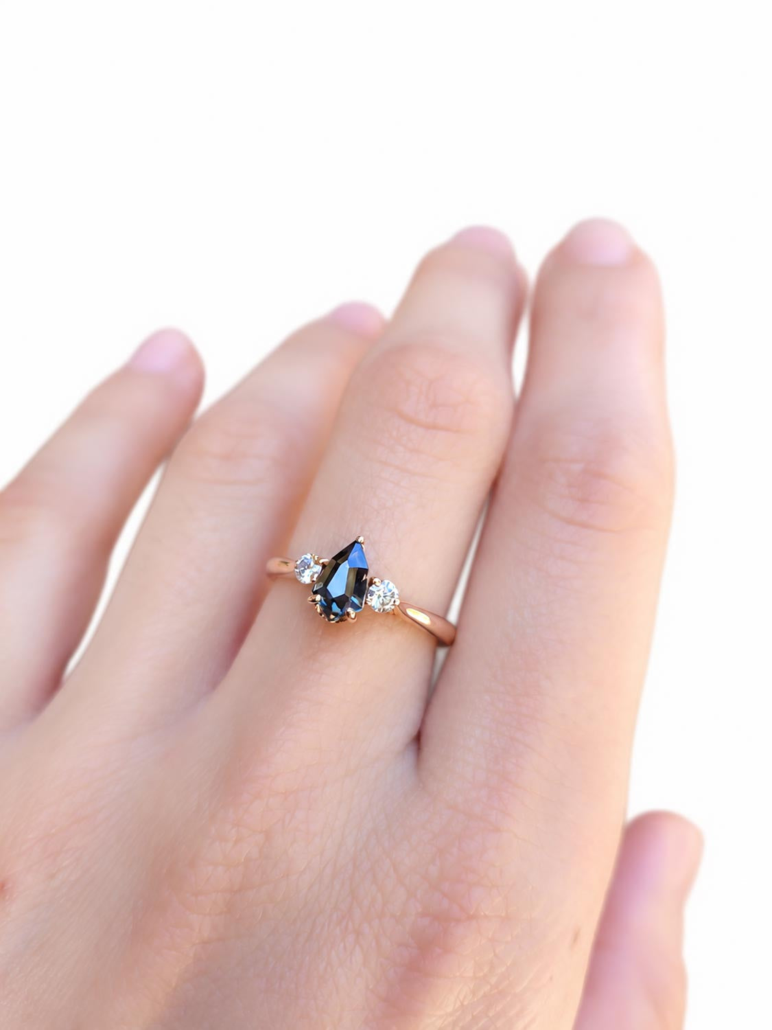 Close detail of the 0.80ct shield cut teal sapphire centre stone
