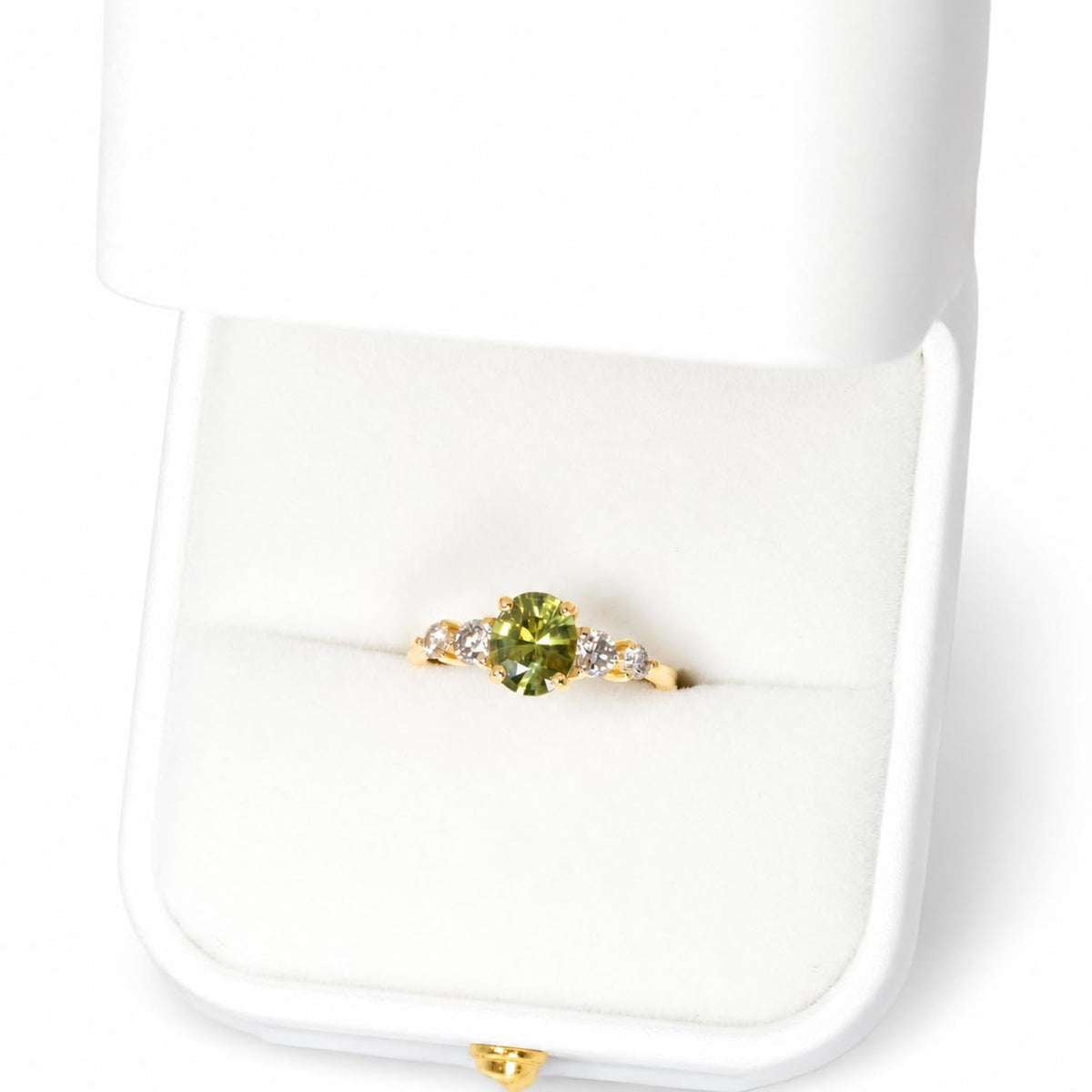 Side profile of the green sapphire and champagne diamond ring in gold