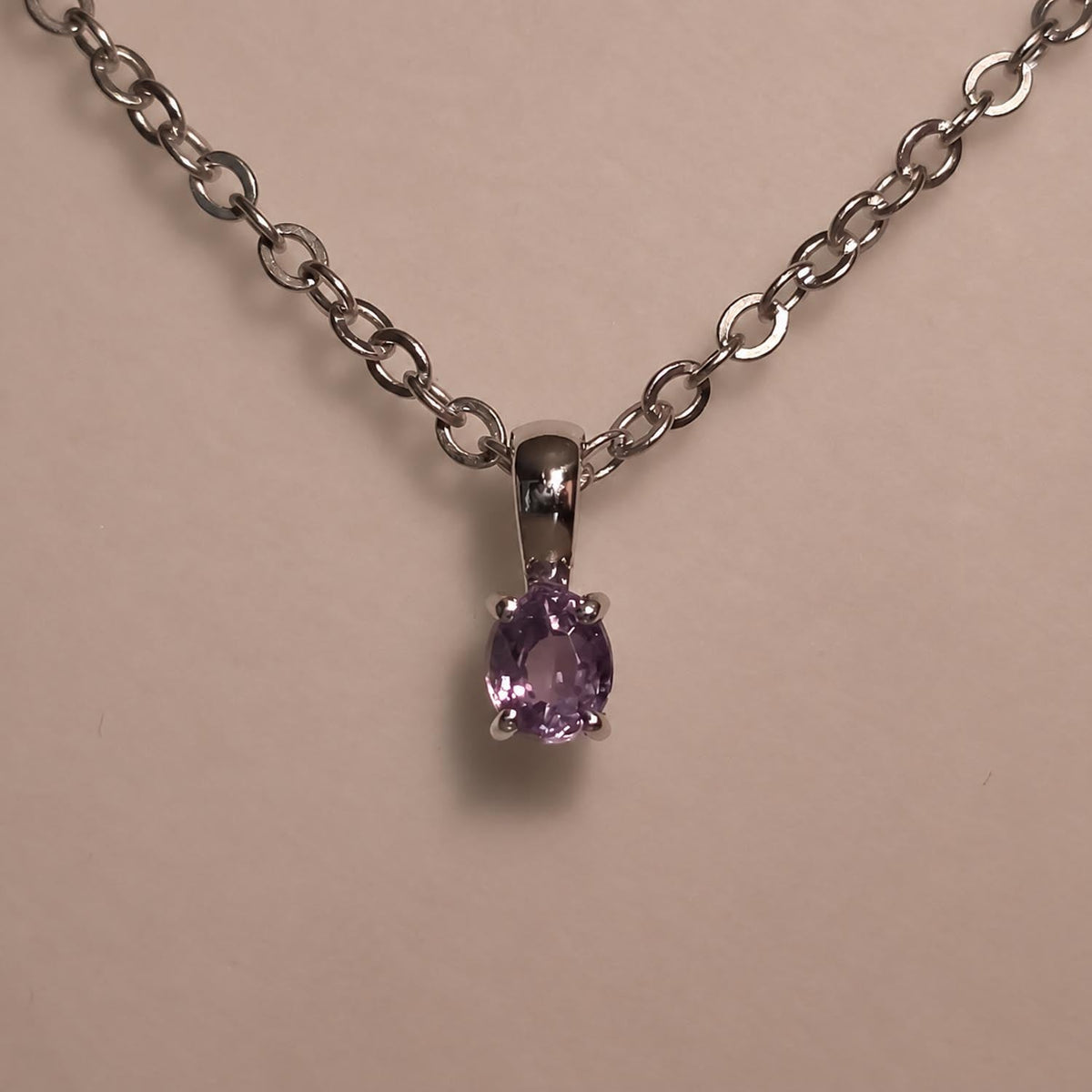 0.18ct oval alexandrite pendant in platinum 950 shown at an angle