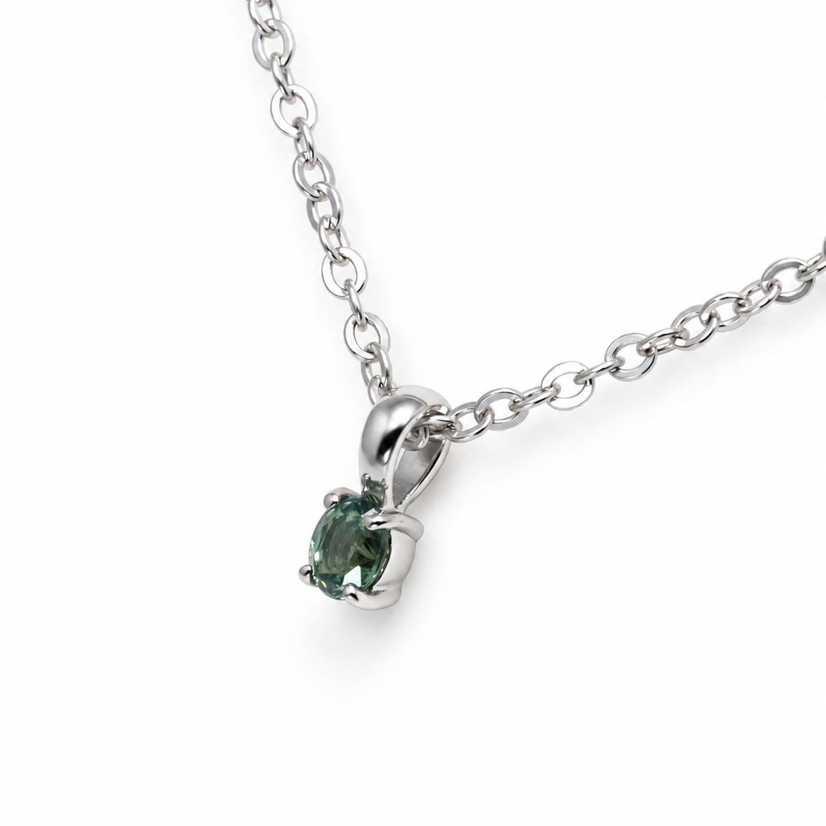 Close detail of the apple green oval alexandrite in platinum