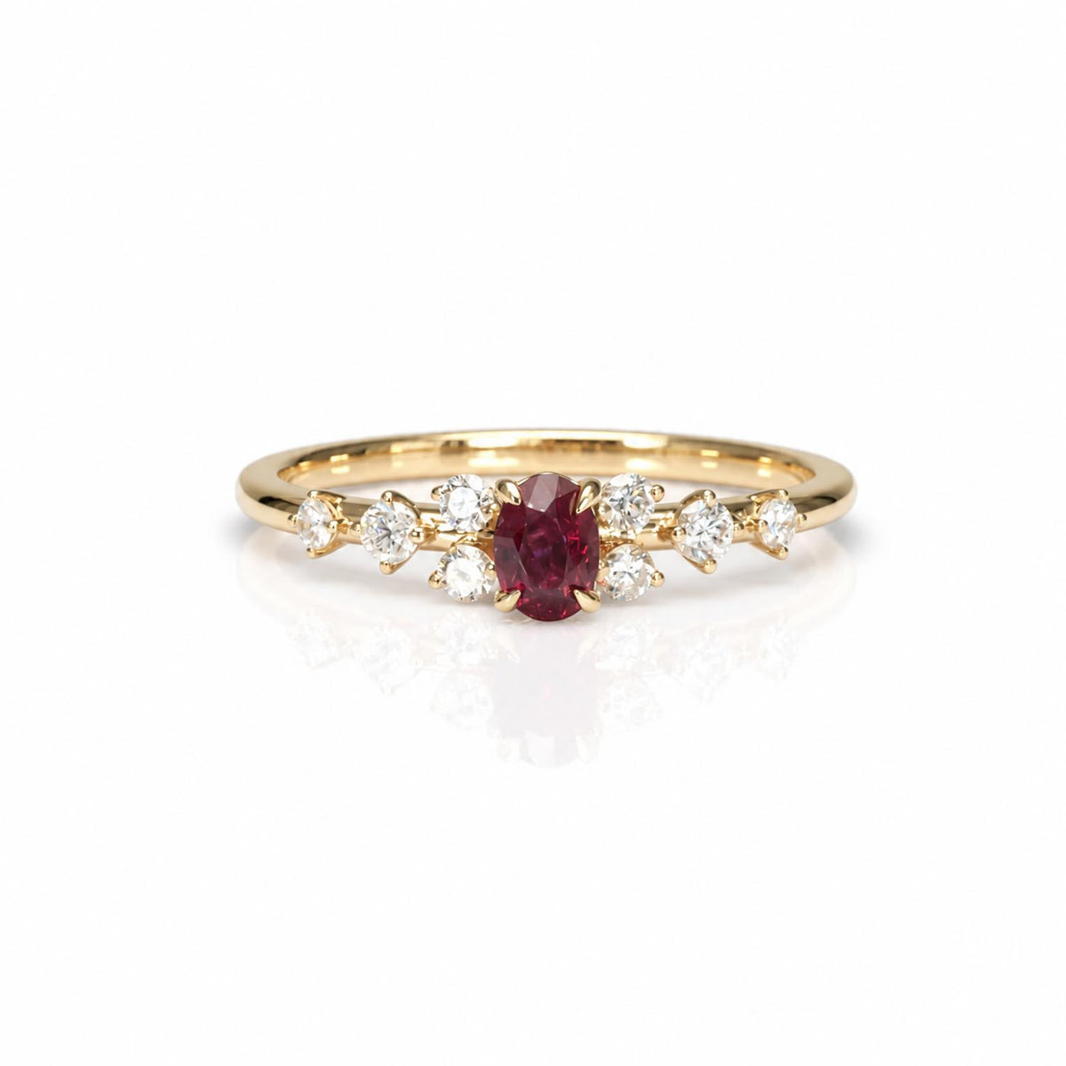 natural ruby and diamonds rings set in yellow gold shown on a white background with a soft reflection