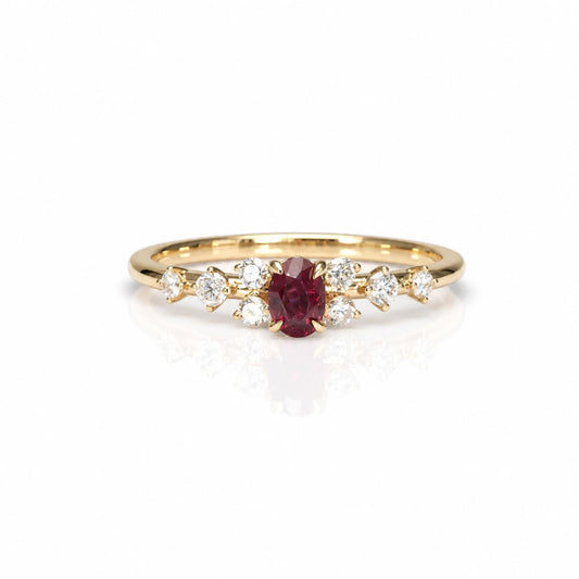 natural ruby and diamonds rings set in yellow gold shown on a white background with a soft reflection