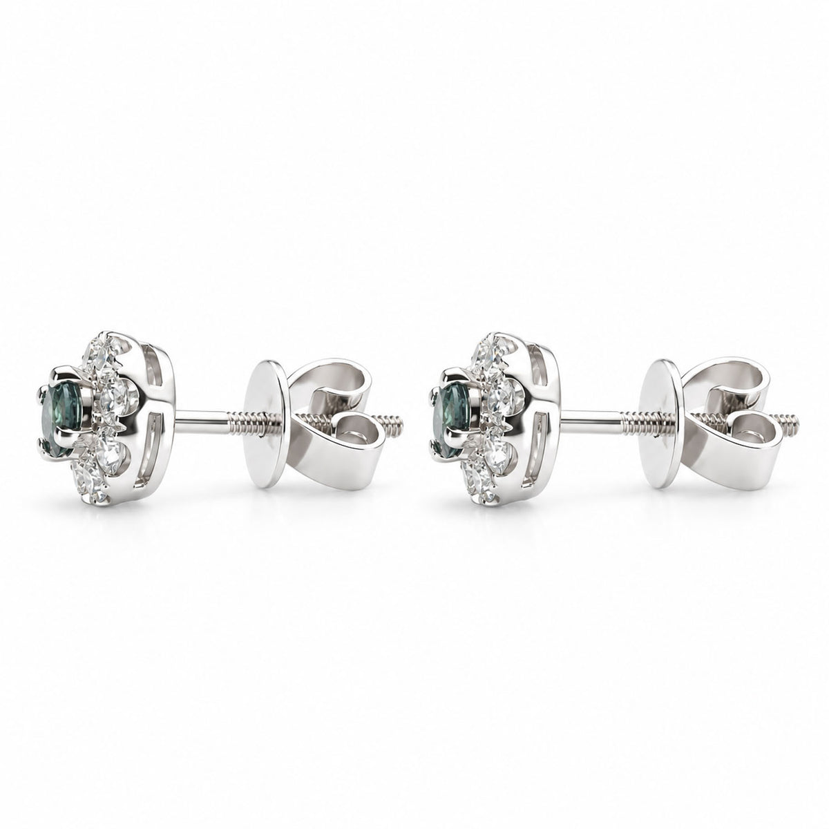 side view of a pair of stud earrings with natural alexandrites at the centre, diamond halos and screw-back closures shown on a white background
