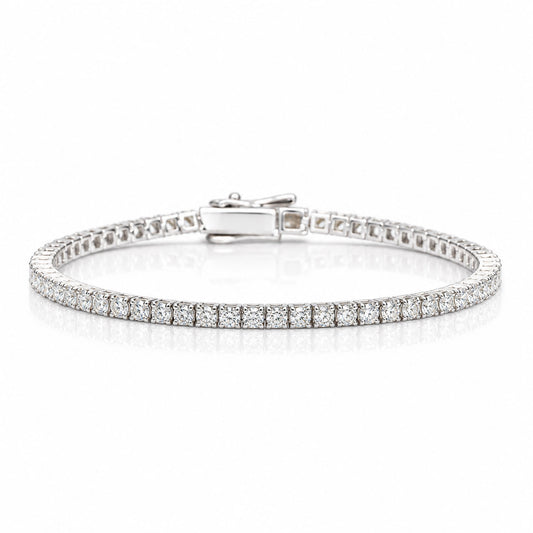 A platinum tennis bracelet with round brilliant cut diamonds shown on a white background with a soft reflection