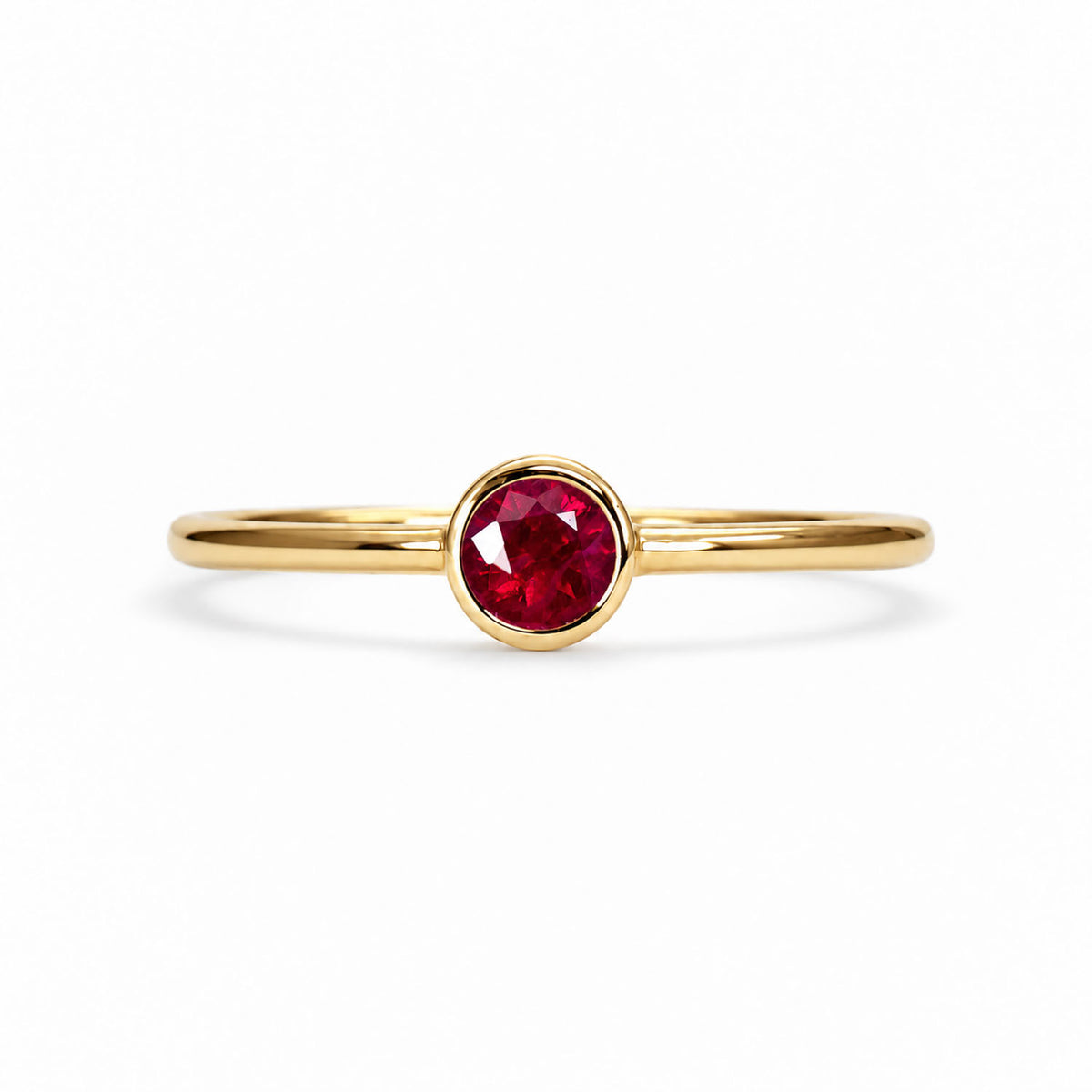 Dainty ruby solitaire ring in 9K yellow gold, bezel set natural ruby