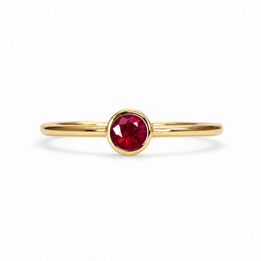 Dainty ruby solitaire ring in 9K yellow gold, bezel set natural ruby