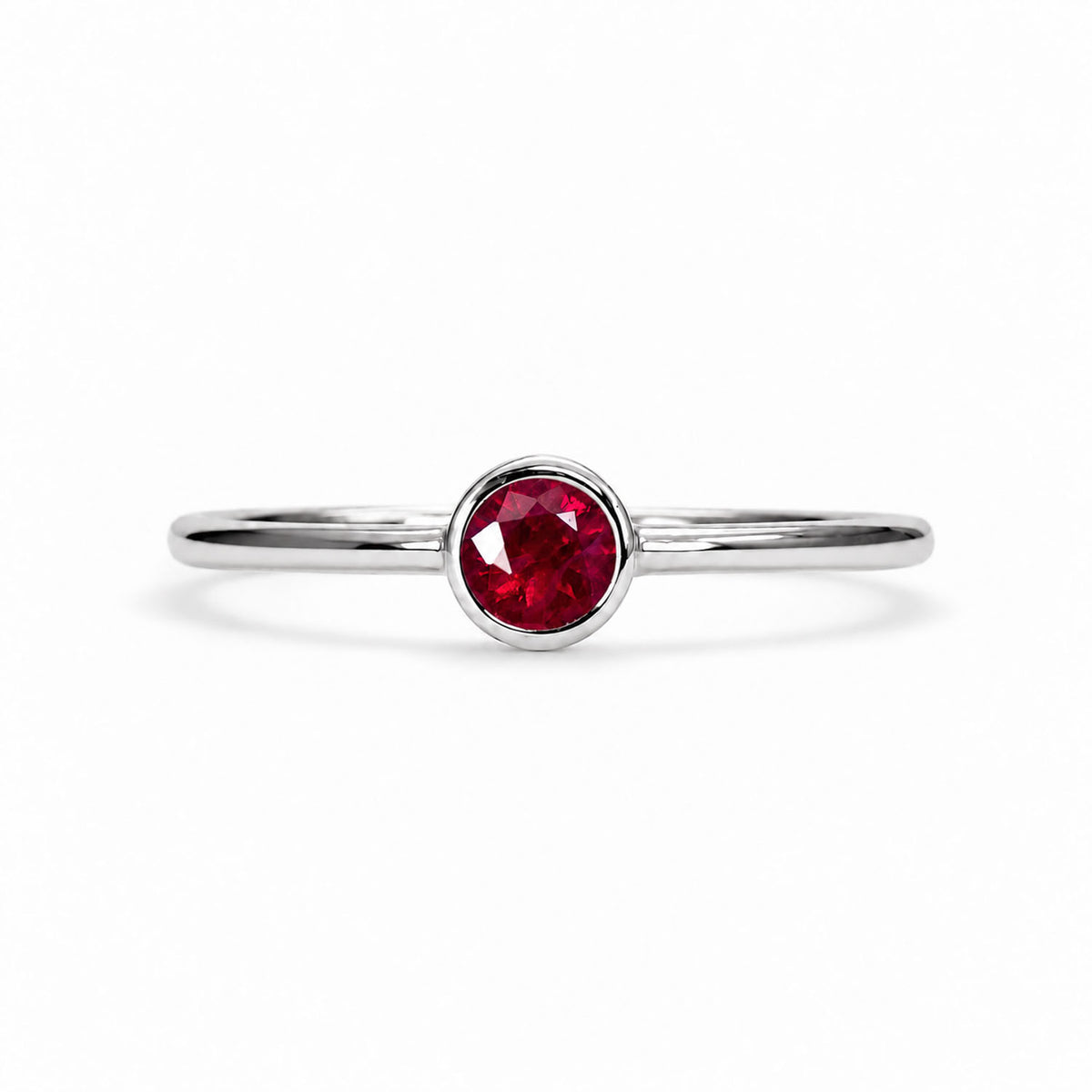 Dainty ruby solitaire ring in 9K white gold, bezel set natural ruby