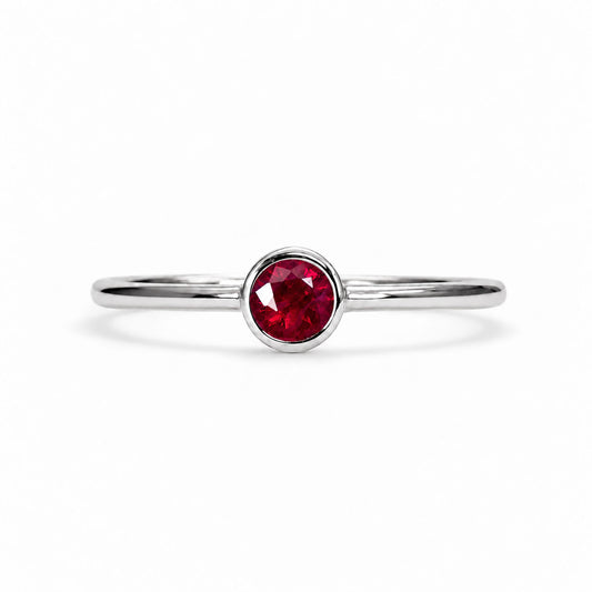 Dainty ruby solitaire ring in 9K white gold, bezel set natural ruby