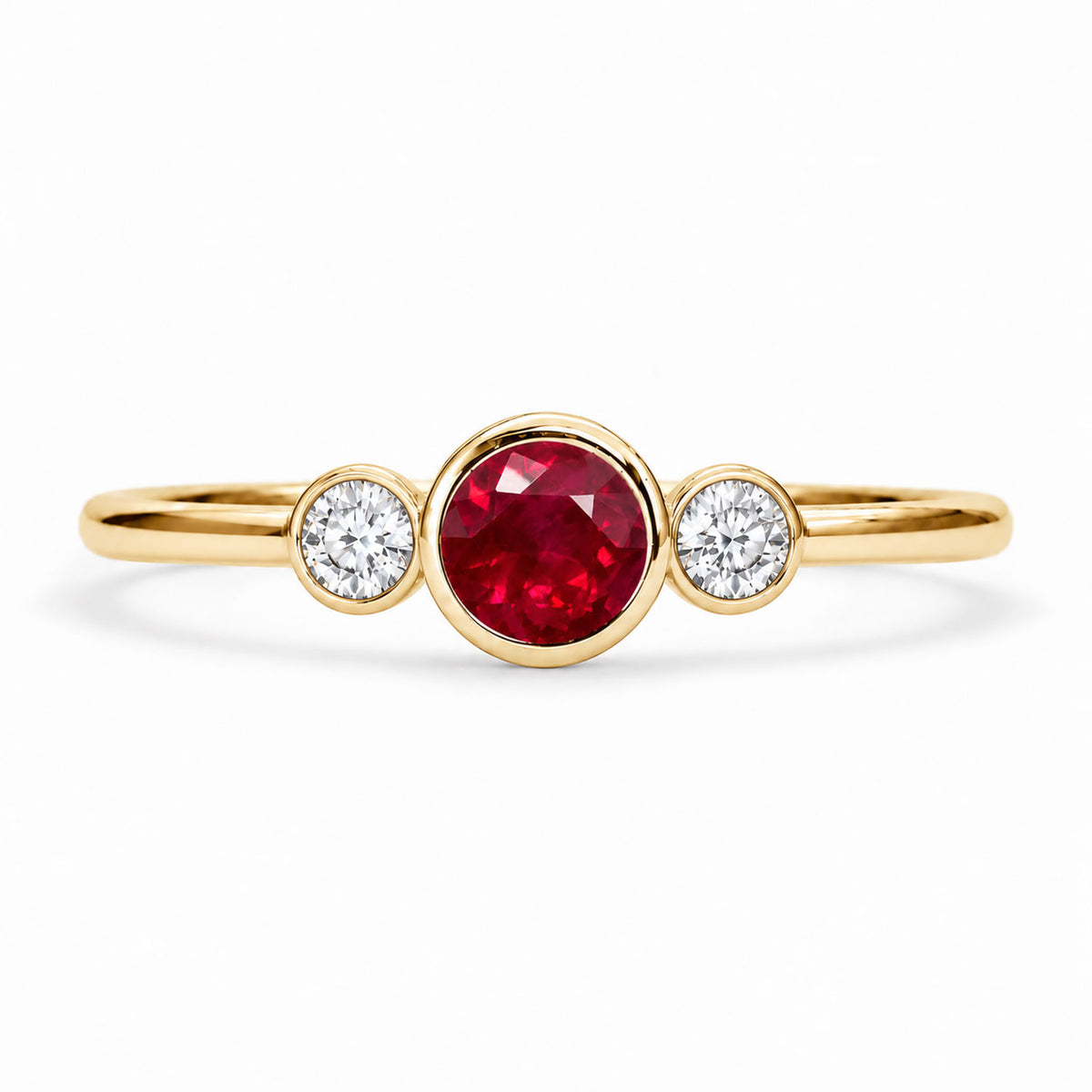 Three stone ruby ring with diamonds, bezel set in 9K yellow gold