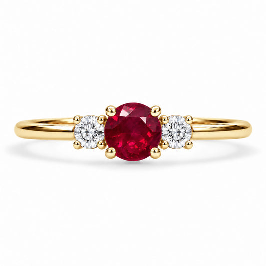 Three stone ruby and diamond ring, claw set in 9K yellow gold