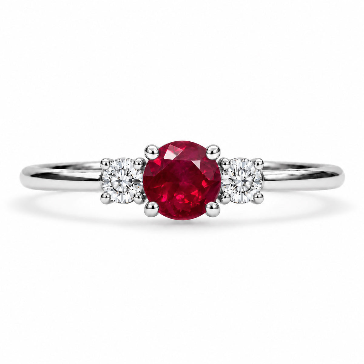 Three stone ruby and diamond ring, claw set in 9K white gold