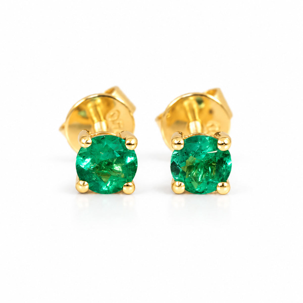 Colombian emerald stud earring in 18K yellow gold showing four-prong setting and screw back
