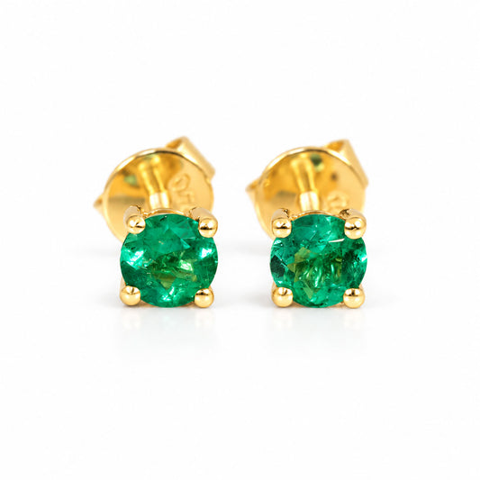 Colombian emerald stud earring in 18K yellow gold showing four-prong setting and screw back