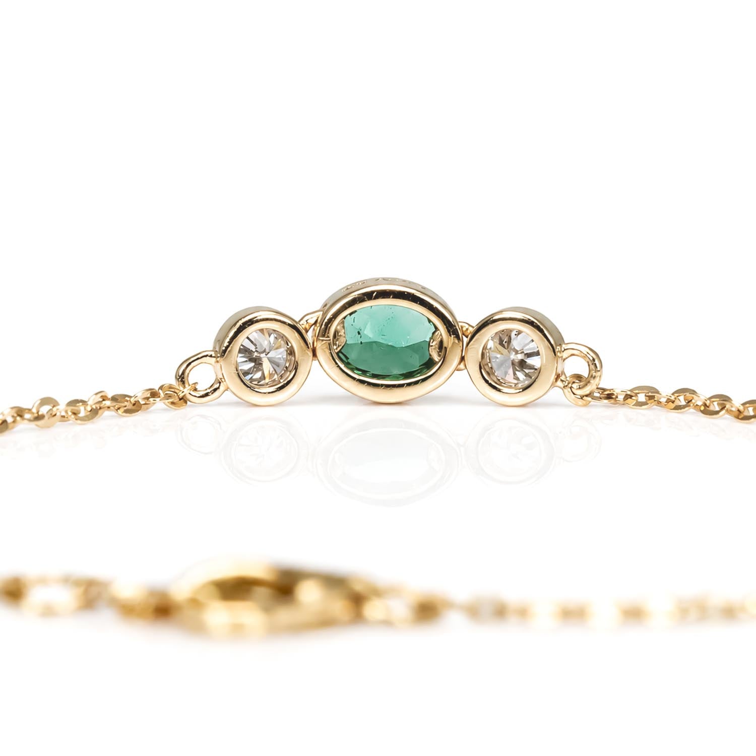 back view of a Natural Colombian Emerald & Diamond Bracelet in 18K Yellow Gold in white background