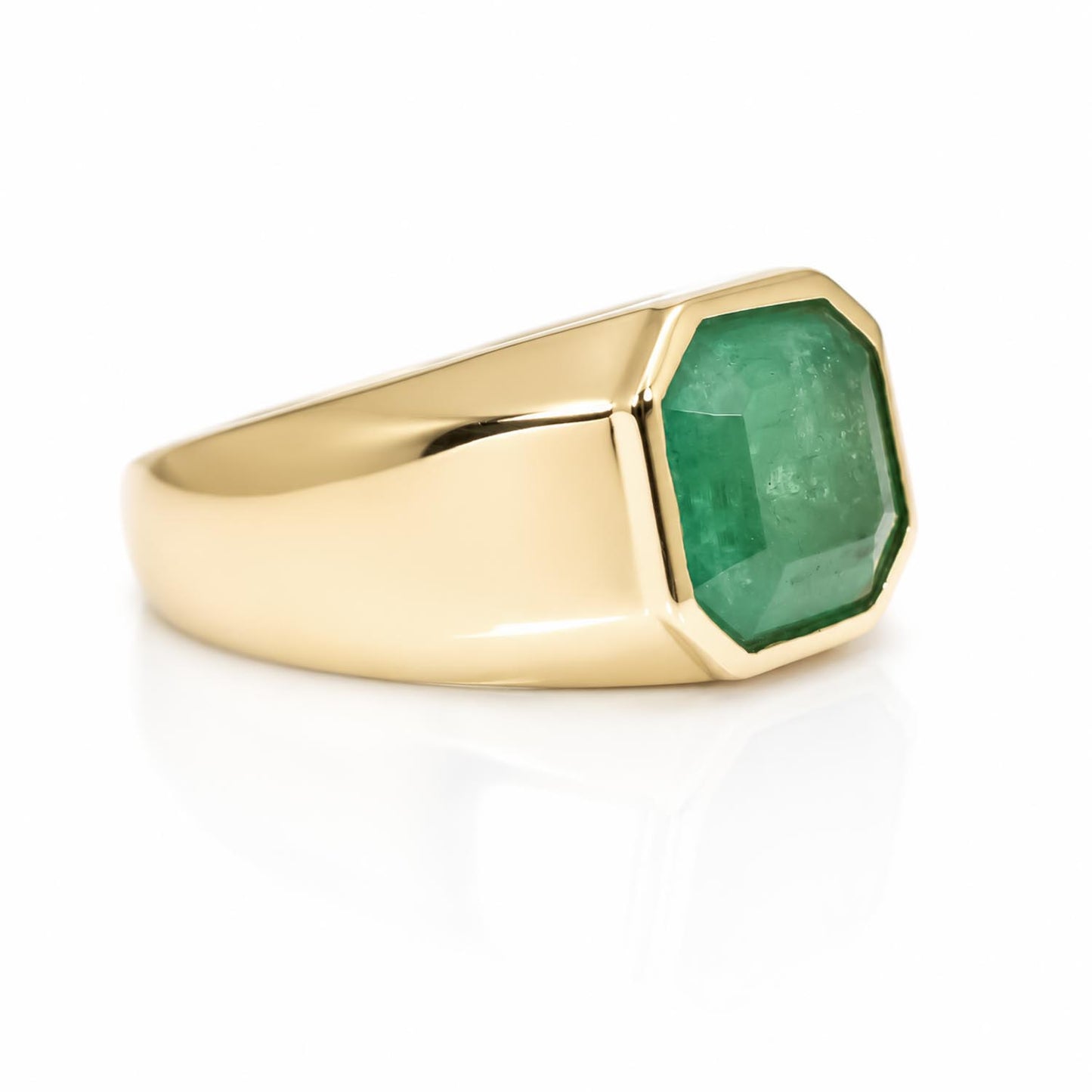 side view of 7.91CT Natural Colombian Emerald Men’s Ring in a white background